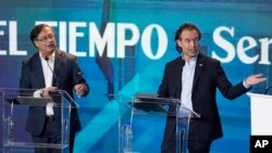 Debate presidencial entre Federico Gutiérrez, candidato presidencial que representa a la coalición Equipo por Colombia, derecha, y el aspirante presidencial Gustavo Petro de la coalición Pacto Histórico. (AP/Fernando Vergara)